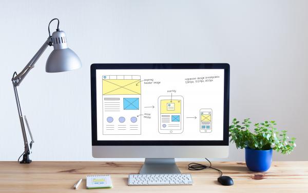 Responsive web design website wireframe sketch layout on computer screen