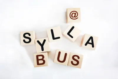 Wooden blocks arranged to spell "@ syllabus"
